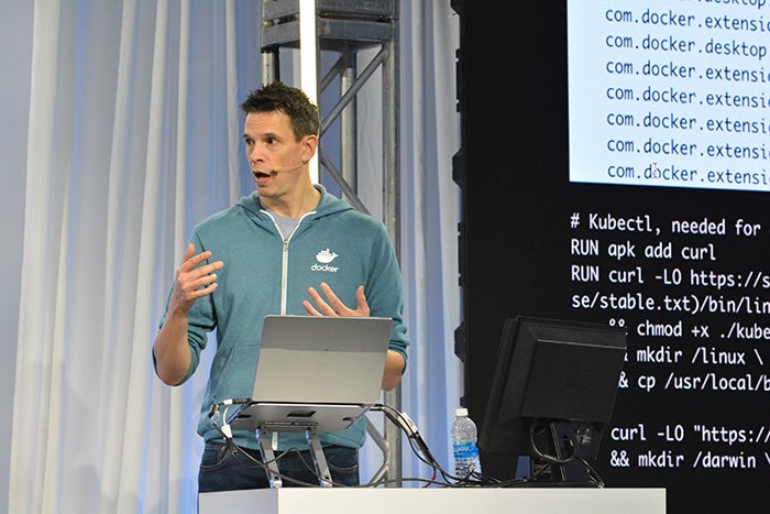 Docker Captain James Spurin speaking at an event